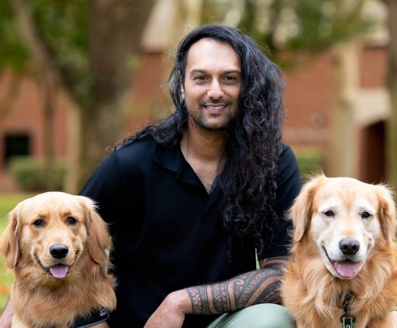 Dr. Amit Lal and two dogs